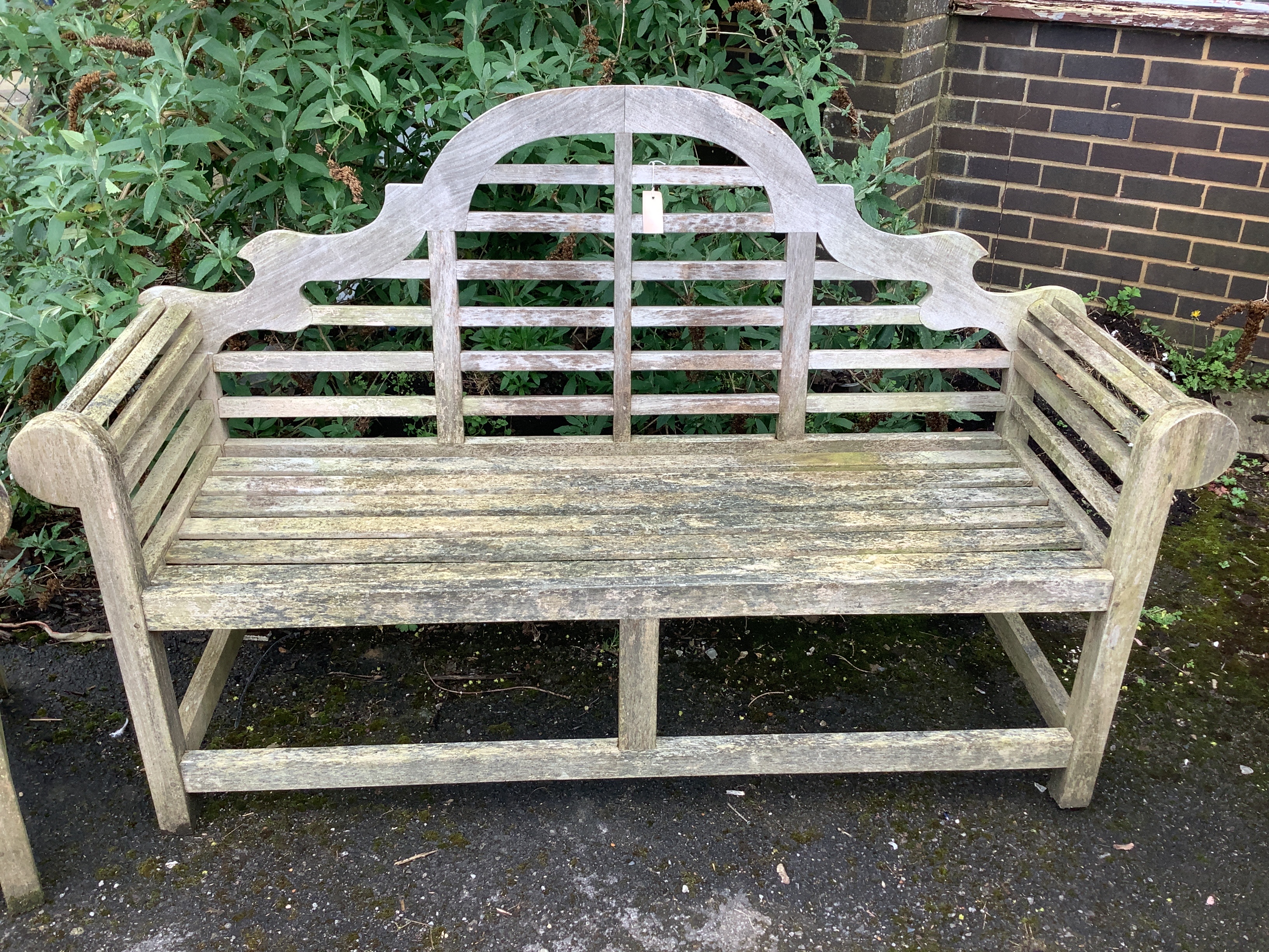 A weathered teak Lutyens style garden bench, width 165cm, depth 56cm, height 106cm